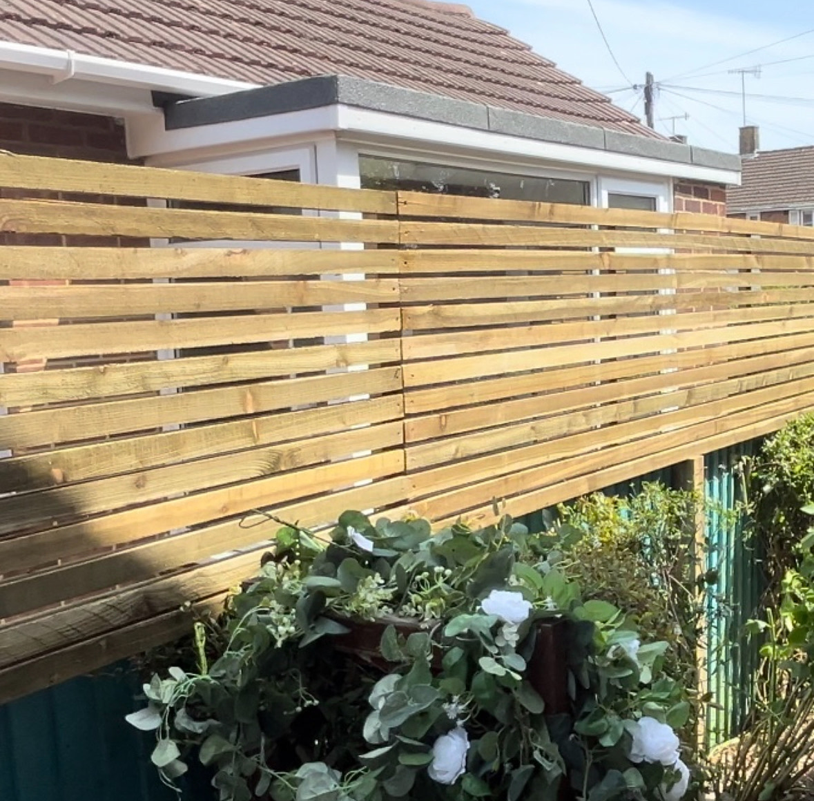 TH Fencing & Landscaping | How Garden Size, Materials, and Labour Affect Fencing Costs in West Sussex Garden fencing installation in West Sussex with wooden close-board panels and concrete posts